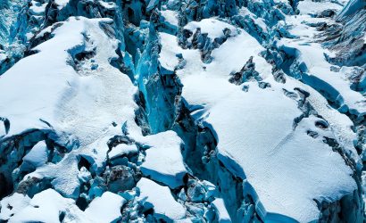 Aerial shot over a glacial serac, shot in the Tordrillo Range of Alaska ice, glacier, snow, blue, white, crevasse, sera, chasm, cracks, Alaska, abstract