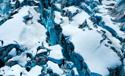 Aerial shot over a glacial serac, shot in the Tordrillo Range of Alaska ice, glacier, snow, blue, white, crevasse, sera, chasm, cracks, Alaska, abstract
