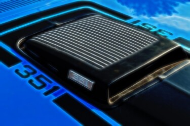 Air scoop on a classic mustang in a blazing 1970s era blue